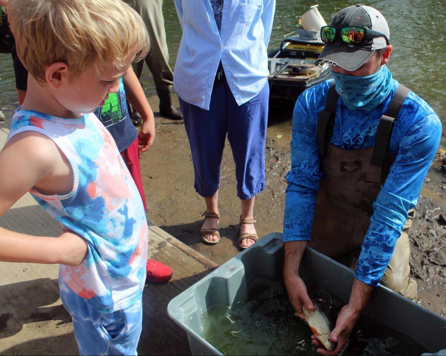 Casey shows Dylan a fish